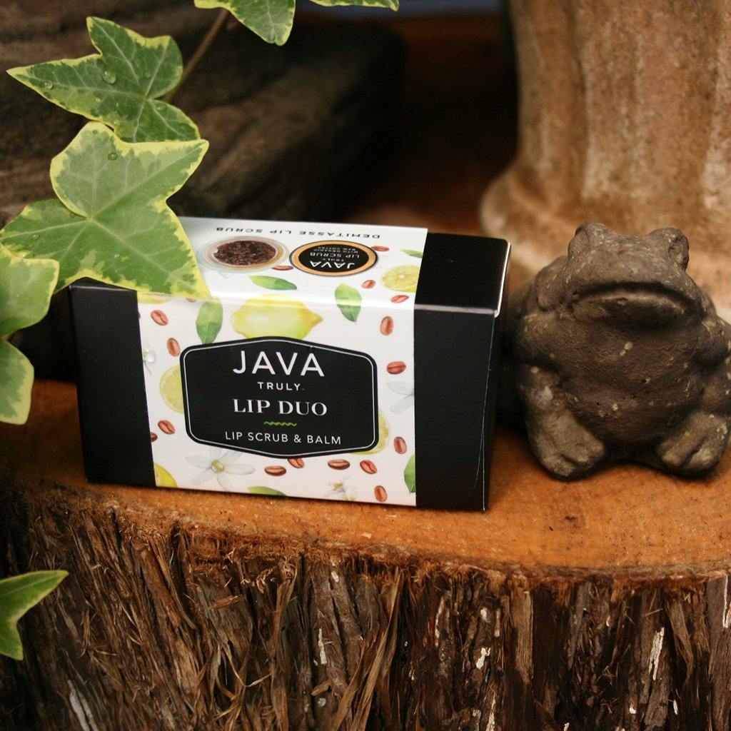 DEMITASSE LIP DUO sitting next to frog statue in greenhouse - Java Skin Care