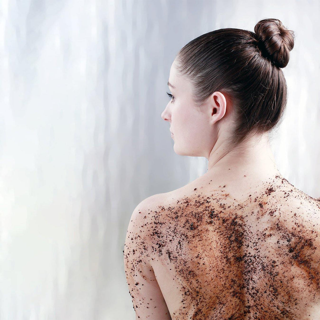 Coffee Bean and Raw Sugar Body Scrub on model's back - Java Skin Care